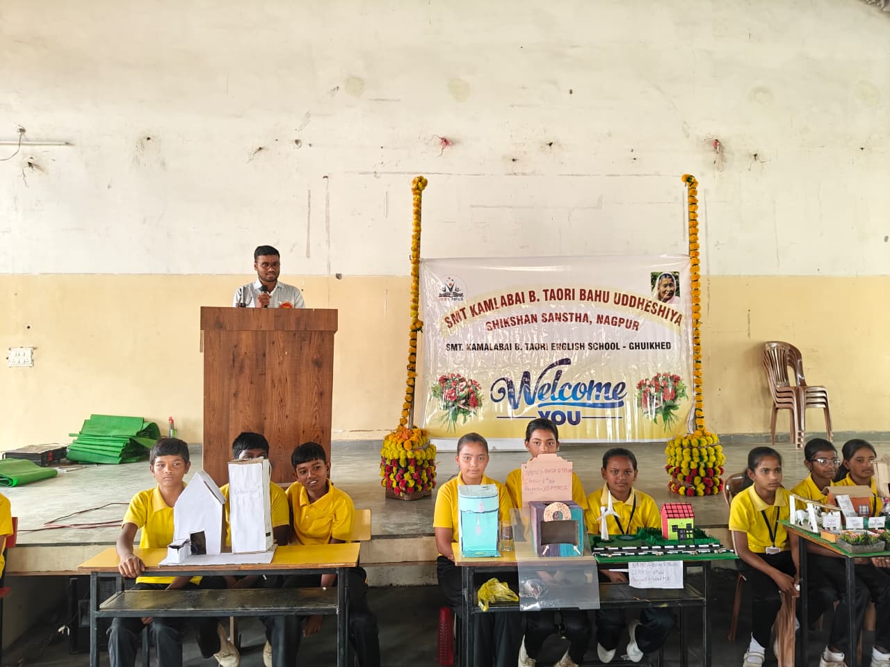 Students presenting science models at National Science Day exhibition